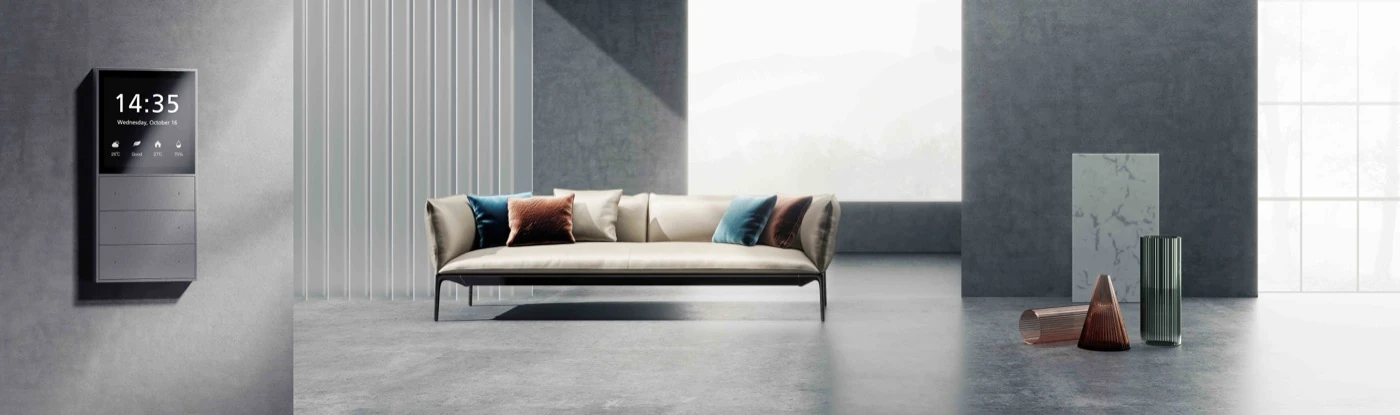 Grey MixPad S installed beside a living room with a sofa and tall windows