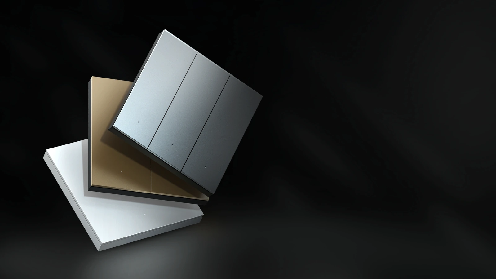Three MixSwitch finishes arranged on a dark surface, showing their precise rocker faces and slim edges
