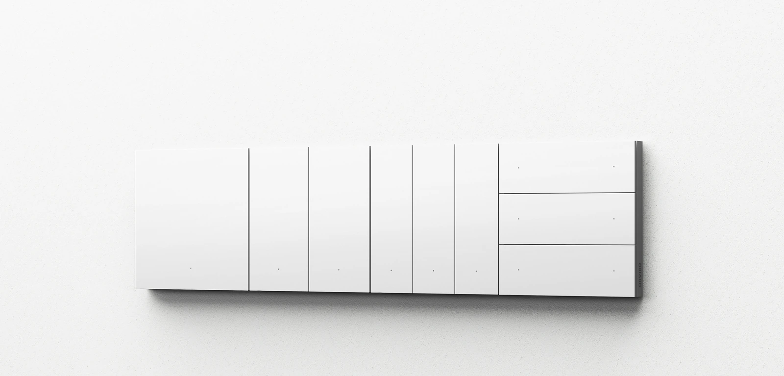 White MixSwitch controls with different button layouts mounted on a pale textured wall